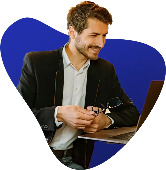 Photo of man using QuickBooks cloud hosting on laptop remote.